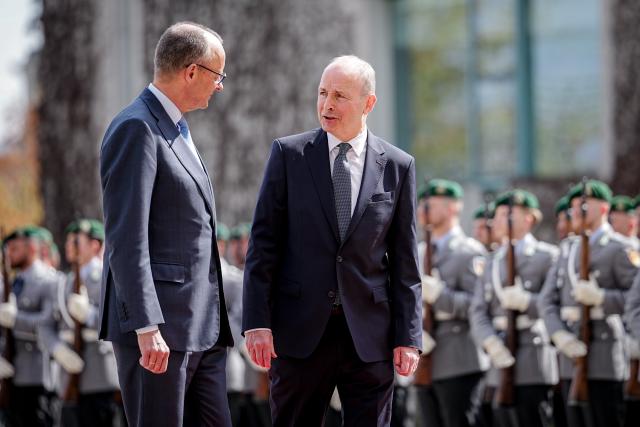 16 April 2026, Berlin: Friedrich Merz (L), Germany's Chancellor, welcomes Micheal Martin, Ireland's Prime Minister, with military honors in front of the Federal Chancellery. Ireland will assume the EU Council Presidency in the second half of 2026. Photo: Kay Nietfeld/dpa