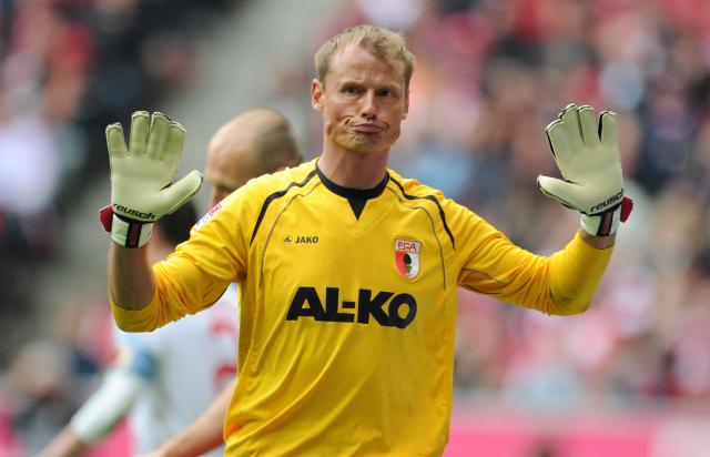 FILED - 11 May 2013, Munich: Then Augsburg goalkeeper Alex Manninger gestures during the German Bundesliga soccer match between Bayern Munich and FC Augsburg at the Allianz Arena. Former Austria goalkeeper Alex Manninger has been killed in a road accident, his first club Red Bull Salzburg announced on Thursday. Photo: picture alliance / dpa