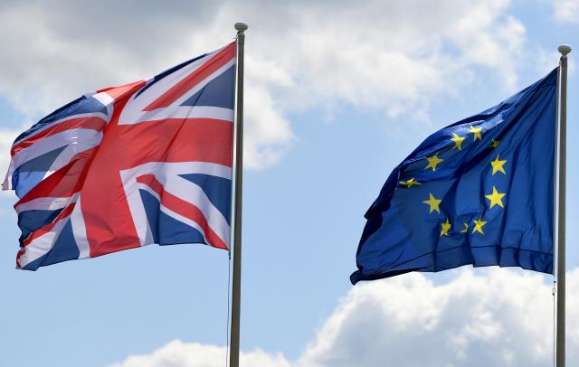 FILED - 07 May 2019, Berlin: The flags of Great Britain and the European Union are waving in the wind at the military part of Tegel Airport. Photo: Monika Skolimowska/dpa-Zentralbild/dpa