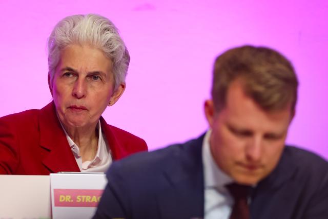 18 April 2026, North Rhine-Westphalia, Duisburg: Marie-Agnes Strack-Zimmermann (L), Chairwoman of the Defense Committee in the European Parliament, sits behind Henning Hoene, Chairman of the FDP in NRW, at the state party conference. Photo: Christoph Reichwein/dpa