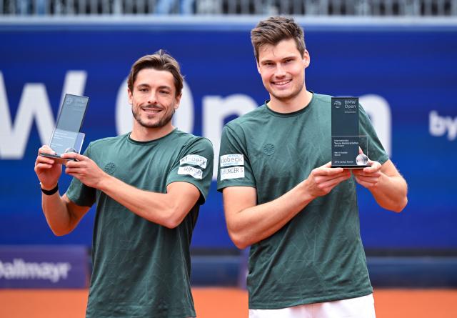 19 April 2026, Bavaria, Munich: German tennis players Jakob Schnaitter (L) and Mark Wallner celebrate victory against France's Arribage and Olivetti after their men's doubles final match of the ATP Tour BMW Open by Bitpanda in Munich.. Photo: Sven Hoppe/dpa