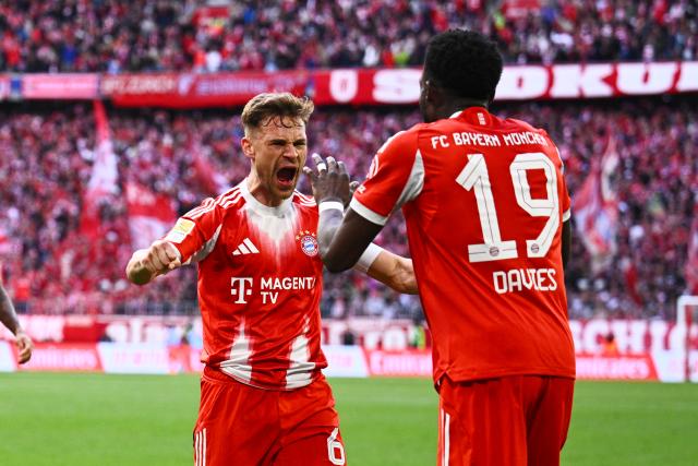 19 April 2026, Bavaria, Munich: Bayern Munich's Joshua Kimmich (L) celebrates with his teammate Alphonso Davies (R)  after his goal during the German Bundesliga soccer match between Bayern Munich and VfB Stuttgart at the Allianz Arena. Photo: Tom Weller/dpa - IMPORTANT NOTICE: DFL and DFB regulations prohibit any use of photographs as image sequences and/or quasi-video.