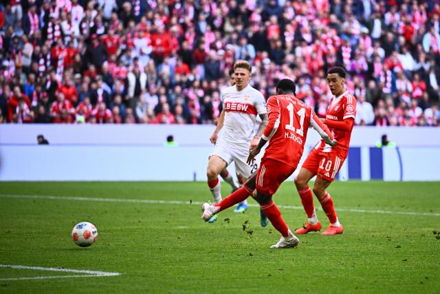 19 April 2026, Bavaria, Munich: Bayern Munich's Nicolas Jackson (f) scores his side's second goal of the game during the German Bundesliga soccer match between Bayern Munich and VfB Stuttgart at the Allianz Arena. Photo: Tom Weller/dpa - IMPORTANT NOTICE: DFL and DFB regulations prohibit any use of photographs as image sequences and/or quasi-video.