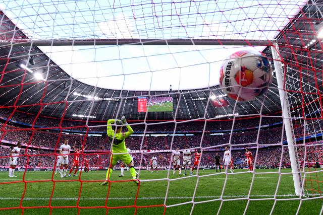 19 April 2026, Bavaria, Munich: Bayern Munich's Alphonso Davies scores his side's thrid goal of the game during the German Bundesliga soccer match between Bayern Munich and VfB Stuttgart at the Allianz Arena. Photo: Tom Weller/dpa - IMPORTANT NOTICE: DFL and DFB regulations prohibit any use of photographs as image sequences and/or quasi-video.