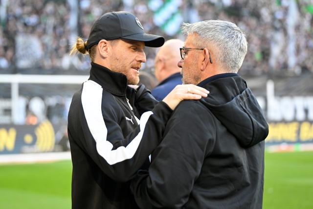 19 April 2026, North Rhine-Westphalia, Moenchengladbach: Moenchengladbach coach Eugen Polanski and Mainz Coach Urs Fischer greet each other ahead of the German Bundesliga soccer match between Borussia Moenchengladbach and FSV Mainz 05 at Borussia-Park Stadium. Photo: Ulrich Hufnagel/dpa - WICHTIGER HINWEIS: Gemäß den Vorgaben der DFL Deutsche Fußball Liga bzw. des DFB Deutscher Fußball-Bund ist es untersagt, in dem Stadion und/oder vom Spiel angefertigte Fotoaufnahmen in Form von Sequenzbildern und/oder videoähnlichen Fotostrecken zu verwerten bzw. verwerten zu lassen.