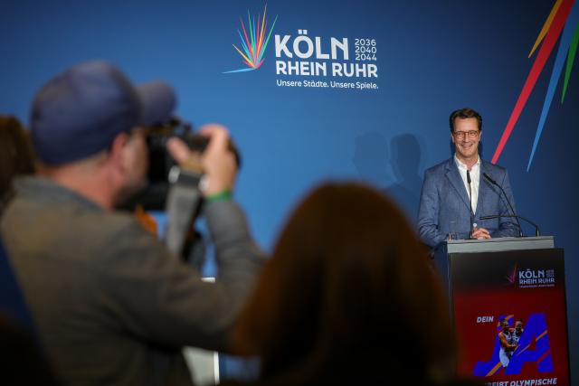 19 April 2026, North Rhine-Westphalia, Cologne: North Rhine-Westphalia Minister-President Hendrik Wuest speaks on stage in Cologne on election night. The vote will determine whether the people of North Rhine-Westphalia support the 'CologneRhineRuhr' bid for the 2036, 2040 or 2044 Olympic and Paralympic Games. In 17 municipalities, more than four million people were able to cast their ballots by mail in referendums. Photo: Christoph Reichwein/dpa