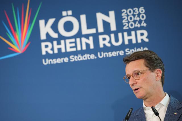 19 April 2026, North Rhine-Westphalia, Cologne: North Rhine-Westphalia Minister-President Hendrik Wuest speaks on stage in Cologne on election night. The vote will determine whether the people of North Rhine-Westphalia support the 'CologneRhineRuhr' bid for the 2036, 2040 or 2044 Olympic and Paralympic Games. In 17 municipalities, more than four million people were able to cast their ballots by mail in referendums. Photo: Christoph Reichwein/dpa
