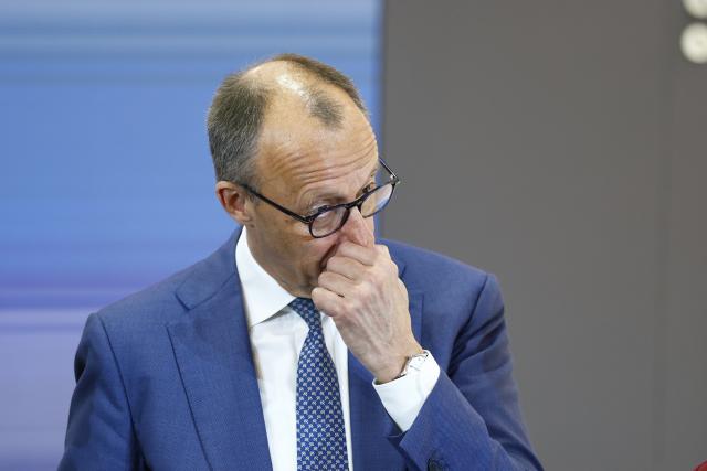 20 April 2026, Lower Saxony, Hanover: German Chancellor Friedrich Merz stands at the Agile Robots stand during  the opening tour of the Hannover Messe. Brazil is the partner country at this year's Hannover Messe. Photo: Moritz Frankenberg/dpa