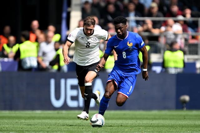 FILED - 08 June 2025, Baden-Wuerttemberg, Stuttgart: France's Aurelien Tchouameni (R) and Germany's Leon Goretzka in action during the UEFA Nations League soccer match between Germany and France at Stuttgart Arena. Photo: Federico Gambarini/dpa