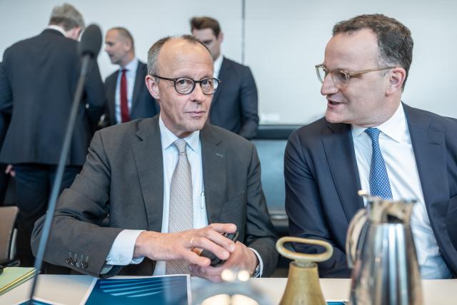 21 April 2026, Berlin: German Chancellor Friedrich Merz (L) speaks with Jens Spahn, Christian Democratic Union (CDU)/Christian Social Union (CSU) parliamentary group leader in the Bundestag, ahead of the parliamentary group meeting at the German Parliament (Bundestag) in Berlin. Photo: Michael Kappeler/dpa