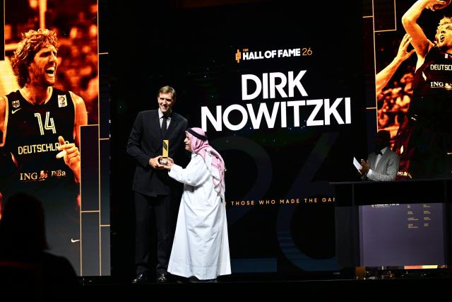 21 April 2026, Berlin: Former German basketball player Dirk Nowitzki receives an award from FIBA President Sheikh Saud Ali Al Thani during the 2026 FIBA Hall of Fame induction ceremony. Photo: Sebastian Gollnow/dpa