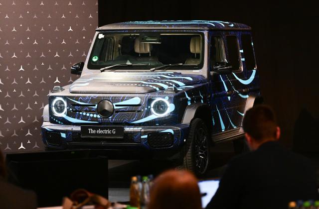 FILED - 22 February 2024, Baden-Württemberg, Stuttgart: A new electric G-Class model stands in the conference room at the annual press conference of vehicle manufacturer Mercedes-Benz. Photo: Bernd Weißbrod/dpa