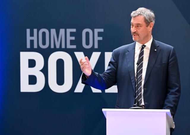 22 April 2026, Bavaria, Munich: Markus Soeder, Prime Minister of Bavaria, attends the opening of the new production line for the highly protected 8x8 wheeled vehicle "BOXER" from KNDS. The new production line is intended to increase the number of deliveries for the Bundeswehr and allied forces. Photo: Sven Hoppe/dpa