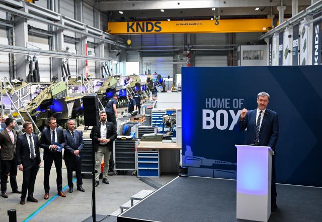 22 April 2026, Bavaria, Munich: Markus Soeder, Prime Minister of Bavaria, attends the opening of the new production line for the highly protected 8x8 wheeled vehicle "BOXER" from KNDS. The new production line is intended to increase the number of deliveries for the Bundeswehr and allied forces. Photo: Sven Hoppe/dpa