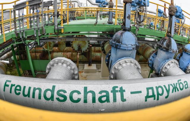 FILED - 22 January 2018, Brandenburg, Schwedt: The inscription "Friendship - Druzhba" is seen on a Russian oil pipeline at the PCK refinery site. Russia will no longer transport oil from Kazakhstan to Germany via its Druzhba pipeline from May, the Interfax news agency reported on Wednesday, citing Deputy Prime Minister Alexander Novak. Photo: Patrick Pleul/dpa-Zentralbild/dpa