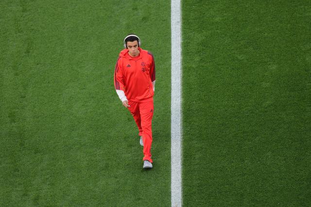 22 April 2026, North Rhine-Westphalia, Leverkusen: Bayern Munich's Jamal Musiala inspects the pitch prior to the start of the German DFB Cup semifinal soccer match between Bayer Leverkusen and Bayern Munich at BayArena. Photo: Rolf Vennenbernd/dpa - IMPORTANT NOTICE: DFL and DFB regulations prohibit any use of photographs as image sequences and/or quasi-video.