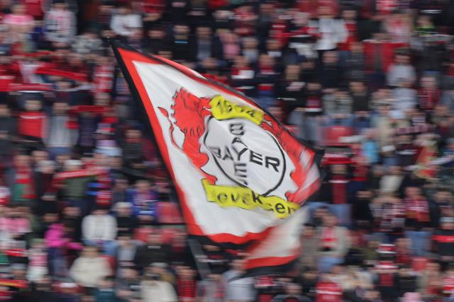 22 April 2026, North Rhine-Westphalia, Leverkusen: Bayer Leverkusen fans wave flag ahead of the the German DFB Cup semifinal soccer match between Bayer Leverkusen and Bayern Munich at BayArena. Photo: Rolf Vennenbernd/dpa - IMPORTANT NOTICE: DFL and DFB regulations prohibit any use of photographs as image sequences and/or quasi-video.