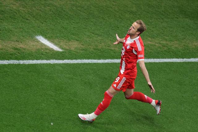 22 April 2026, North Rhine-Westphalia, Leverkusen: Bayern Munich's Harry Kane celebrates scoring his side's first goal during the German DFB Cup semifinal soccer match between Bayer Leverkusen and Bayern Munich at BayArena. Photo: Rolf Vennenbernd/dpa - IMPORTANT NOTICE: DFL and DFB regulations prohibit any use of photographs as image sequences and/or quasi-video.