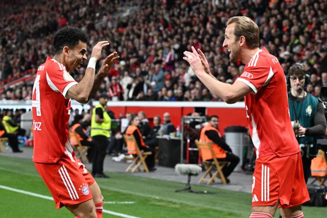 22 April 2026, North Rhine-Westphalia, Leverkusen: Bayern Munich's Harry Kane (R) celebrates scoring his side's first goal with teammate Luis Diaz during the German DFB Cup semifinal soccer match between Bayer Leverkusen and Bayern Munich at BayArena. Photo: Federico Gambarini/dpa - IMPORTANT NOTICE: DFL and DFB regulations prohibit any use of photographs as image sequences and/or quasi-video.