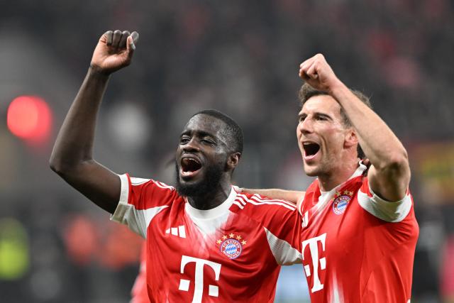 22 April 2026, North Rhine-Westphalia, Leverkusen: Bayern Munich's Dayot Upamecano (L) and Leon Goretzka celebrate after the German DFB Cup semifinal soccer match between Bayer Leverkusen and Bayern Munich at BayArena. Photo: Federico Gambarini/dpa - IMPORTANT NOTICE: DFL and DFB regulations prohibit any use of photographs as image sequences and/or quasi-video.
