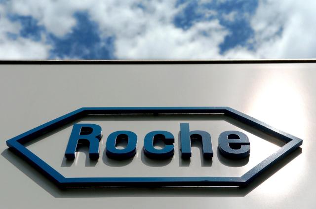 FILED - 20 July 2004, Bavaria, Penzberg: The logo of the Swiss pharmaceutical company Roche is seen at the entrance of the plant in Penzberg near Bad Toelz. Photo: Daniel Karmann/dpa