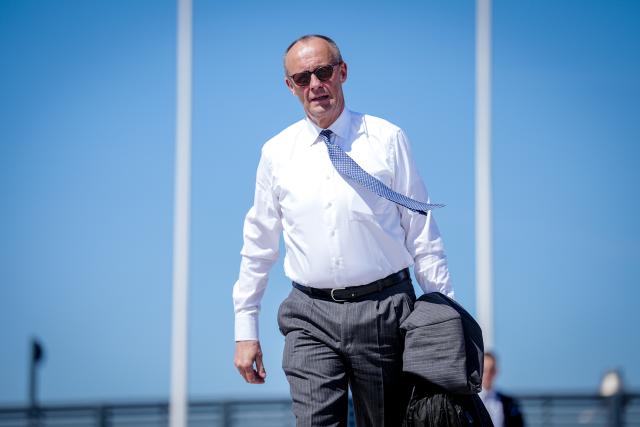 23 April 2026, Brandenburg, Schönefeld: German Chancellor Friedrich Merz  walks to the Airbus A321 of the German Air Force for the flight to Cyprus at the military section of Berlin-Brandenburg BER Airport. The informal meeting of EU heads of state and government is taking place in Nicosia. At the dinner, Ukrainian President Zelensky is to inform the 27 EU heads of state and government about current developments in Russia's war of aggression against Ukraine via video link. The EU leaders will then discuss the conflicts in the Middle East and the resulting energy crisis. Photo: Kay Nietfeld/dpa