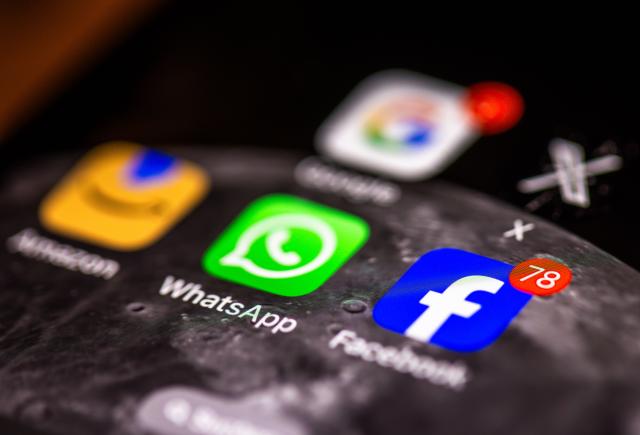 FILED - 10 April 2025, Mecklenburg-Western Pomerania, Schwerin: Apps of various American tech companies, Google, WhatsApp, Amazon and Facebook, can be seen on the display of a smartphone. Photo: Jens Büttner/dpa