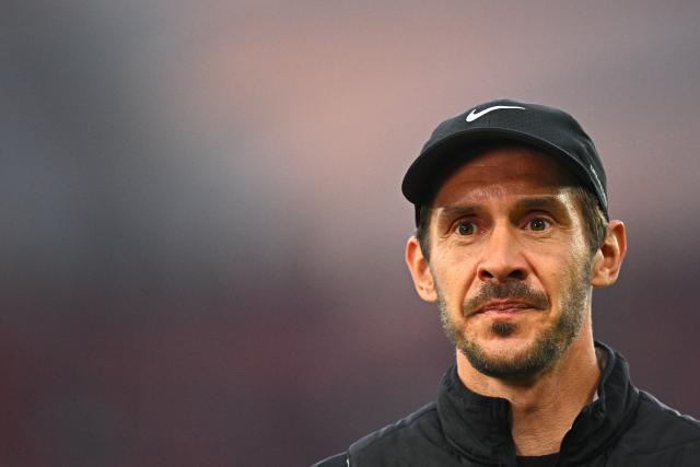 23 April 2026, Baden-Wuerttemberg, Stuttgart: Freiburg coach Julian Schuster walks on the pitch ahead of the German DFB Cup semifinal soccer match between VfB Stuttgart and SC Freiburg at MHPArena. Photo: Tom Weller/dpa - IMPORTANT NOTICE: DFL and DFB regulations prohibit any use of photographs as image sequences and/or quasi-video.
