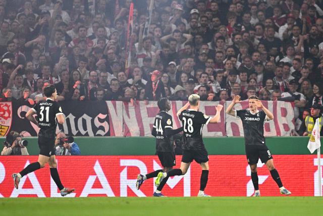 23 April 2026, Baden-Wuerttemberg, Stuttgart: Freiburg's Maximilian Eggestein (R) celebrates his side's first goal of the game during the German DFB Cup semifinal soccer match between VfB Stuttgart and SC Freiburg at MHPArena. Photo: Tom Weller/dpa - IMPORTANT NOTICE: DFL and DFB regulations prohibit any use of photographs as image sequences and/or quasi-video.