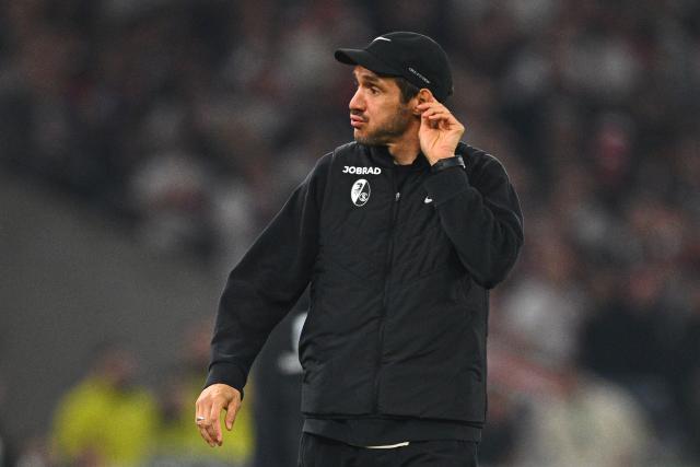 23 April 2026, Baden-Wuerttemberg, Stuttgart: Freiburg coach Julian Schuster reacts on the touchline during the German DFB Cup semifinal soccer match between VfB Stuttgart and SC Freiburg at MHPArena. Photo: Tom Weller/dpa - IMPORTANT NOTICE: DFL and DFB regulations prohibit any use of photographs as image sequences and/or quasi-video.
