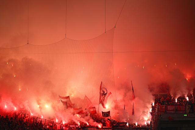 23 April 2026, Baden-Wuerttemberg, Stuttgart: Freiburg fans set off pyrotechnics during the German DFB Cup semifinal soccer match between VfB Stuttgart and SC Freiburg at MHPArena. Photo: Tom Weller/dpa - IMPORTANT NOTICE: DFL and DFB regulations prohibit any use of photographs as image sequences and/or quasi-video.