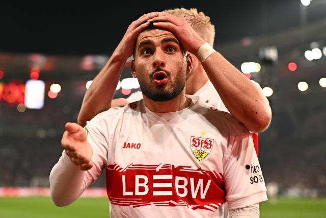 23 April 2026, Baden-Wuerttemberg, Stuttgart: Stuttgart's Deniz Undav celebrates with his teammate Ermedin Demirovic (R) after scoring his side's first goal of the game during the German DFB Cup semifinal soccer match between VfB Stuttgart and SC Freiburg at MHPArena. Photo: Tom Weller/dpa - IMPORTANT NOTICE: DFL and DFB regulations prohibit any use of photographs as image sequences and/or quasi-video.