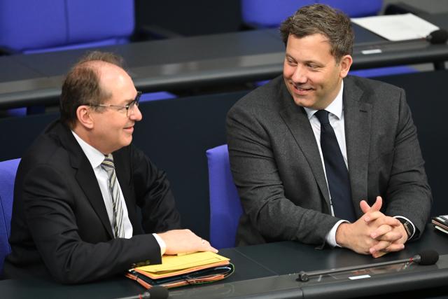24 April 2026, Berlin: Lars Klingbeil (R), German Minister of Finance, speaks with Alexander Dobrindt, German Minister of the Interior, during the plenary session of the Bundestag. Topics include the planned fuel rebate and relief premiums. Photo: Markus Lenhardt/dpa