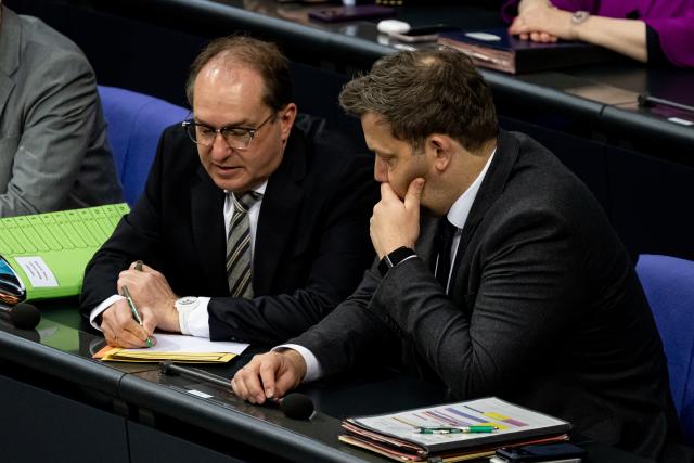 24 April 2026, Berlin: Lars Klingbeil (R), German Minister of Finance, speaks with Alexander Dobrindt, German Minister of the Interior, during the plenary session of the Bundestag. Topics include the planned fuel rebate and relief premiums. Photo: Fabian Sommer/dpa