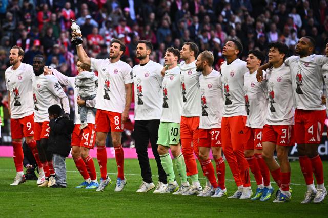 FILED - 19 April 2026, Bavaria, Munich: Bayern Munich players celebrate winning the German Bundesliga championship after the final whistle of the German Bundesliga soccer match between Bayern Munich and VfB Stuttgart at the Allianz Arena. Photo: Tom Weller/dpa - IMPORTANT NOTICE: DFL and DFB regulations prohibit any use of photographs as image sequences and/or quasi-video.