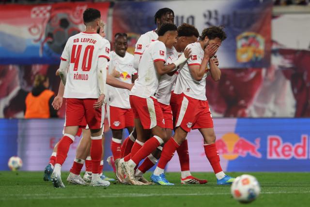 24 April 2026, Saxony, Leipzig: Leipzig's Max Finkgraefe (R) celebrates after scoring his side's first goal of the game during the German Bundesliga soccer match between RB Leipzig and 1. FC Union Berlin at Red Bull Arena. Photo: Jan Woitas/dpa - IMPORTANT NOTICE: DFL and DFB regulations prohibit any use of photographs as image sequences and/or quasi-video.