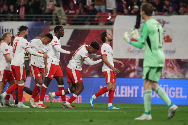 24 April 2026, Saxony, Leipzig: Leipzig's Max Finkgraefe (2nd R) celebrates after scoring his side's first goal of the game during the German Bundesliga soccer match between RB Leipzig and 1. FC Union Berlin at Red Bull Arena. Photo: Jan Woitas/dpa - IMPORTANT NOTICE: DFL and DFB regulations prohibit any use of photographs as image sequences and/or quasi-video.