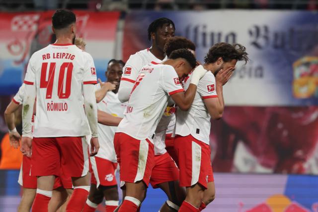 24 April 2026, Saxony, Leipzig: Leipzig's Max Finkgraefe (R) celebrates after scoring his side's first goal of the game the during the German Bundesliga soccer match between RB Leipzig and 1. FC Union Berlin at Red Bull Arena. Photo: Jan Woitas/dpa - IMPORTANT NOTICE: DFL and DFB regulations prohibit any use of photographs as image sequences and/or quasi-video.