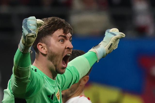 24 April 2026, Saxony, Leipzig: Union Berlin goalkeeper Carl Klaus celebrates his side's first goal during the German Bundesliga soccer match between RB Leipzig and 1. FC Union Berlin at Red Bull Arena. Photo: Jan Woitas/dpa - IMPORTANT NOTICE: DFL and DFB regulations prohibit any use of photographs as image sequences and/or quasi-video.