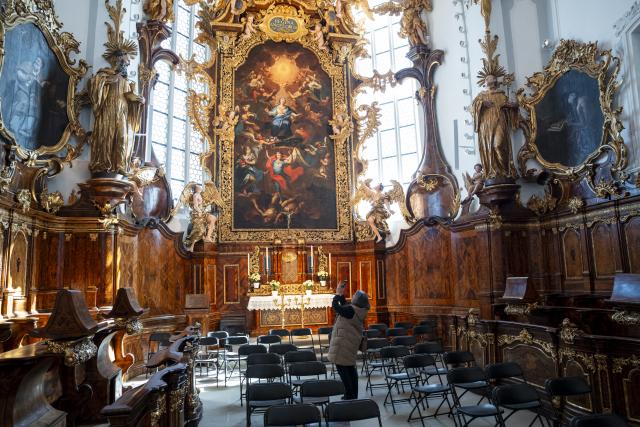 PRODUCTION - 24 April 2026, Bavaria, Bamberg: Susanne Fischer, Head of the Department for the Preservation of Monuments at the Bavarian State Office for the Preservation of Monuments, takes a photo of the high choir of St. Michael's Church. The former abbey church of the St. Michael monastery complex is reopened after 14 years of renovation. Photo: Daniel Vogl/dpa