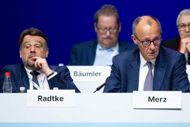 25 April 2026, Hesse, Marburg: German Chancellor Friedrich Merz and Dennis Radtke (R), CDA Federal Chairman, take part in the 41st Federal Conference of the Christian Democratic Workers' Association (CDA). Photo: Florian Wiegand/dpa