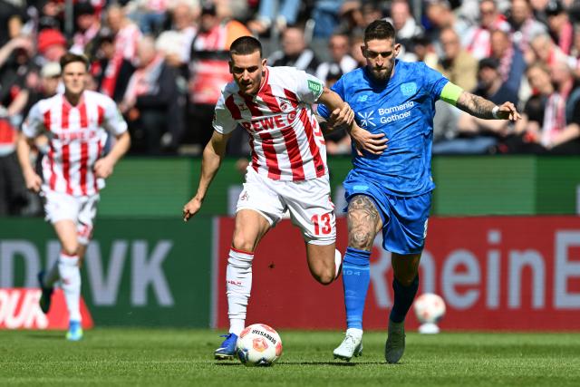 25 April 2026, North Rhine-Westphalia, Cologne: Cologne's Said El Mala and Leverkusen's Robert Andrich battle for the ball during the German Bundesliga soccer match between 1. FC Cologne and Bayer Leverkusen at RheinEnergieSTADION. Photo: Federico Gambarini/dpa - WICHTIGER HINWEIS: Gemäß den Vorgaben der DFL Deutsche Fußball Liga bzw. des DFB Deutscher Fußball-Bund ist es untersagt, in dem Stadion und/oder vom Spiel angefertigte Fotoaufnahmen in Form von Sequenzbildern und/oder videoähnlichen Fotostrecken zu verwerten bzw. verwerten zu lassen.