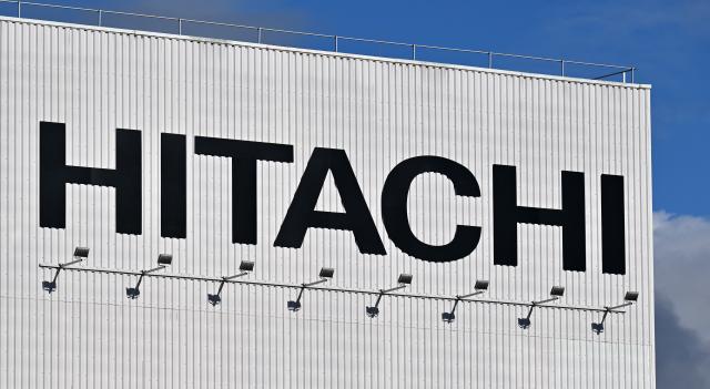 FILED - 21 October 2025, Thuringia, Arnstadt: A sign with Hitachi lettering can be seen at the Arnstadt plant of Hitachi Rail GTS Deutschland GmbH. Photo: Martin Schutt/dpa