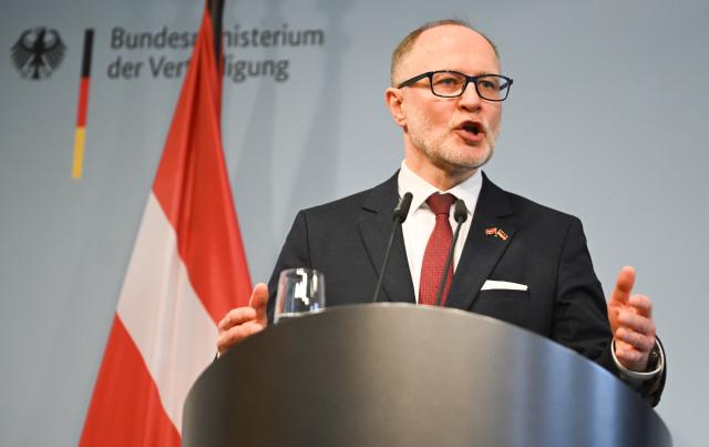 FILED - 16 March 2026, Berlin: Latvian Defense Minister Andris Spruds speaks at a press conference. Photo: Britta Pedersen/dpa