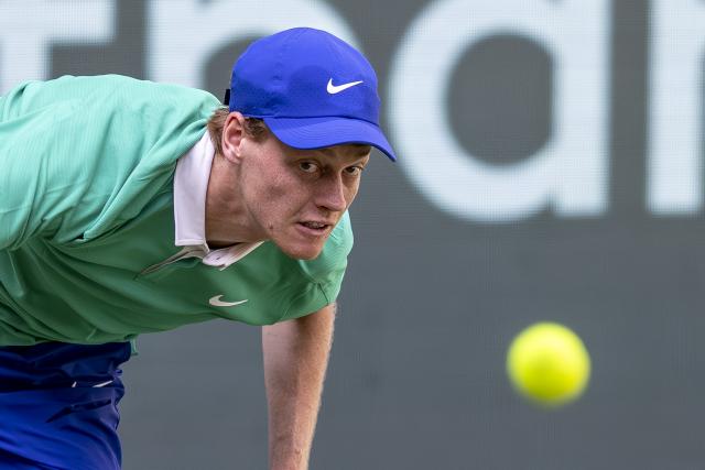 FILED - 17 June 2025, North Rhine-Westphalia, Halle (westfalen): Italian tennis player Jannik Sinner looks at the ball during his men's singles first-round match against Germany's Yannick Hanfmann at the Terra Wortmann Open tennis tournament. Photo: David Inderlied/dpa