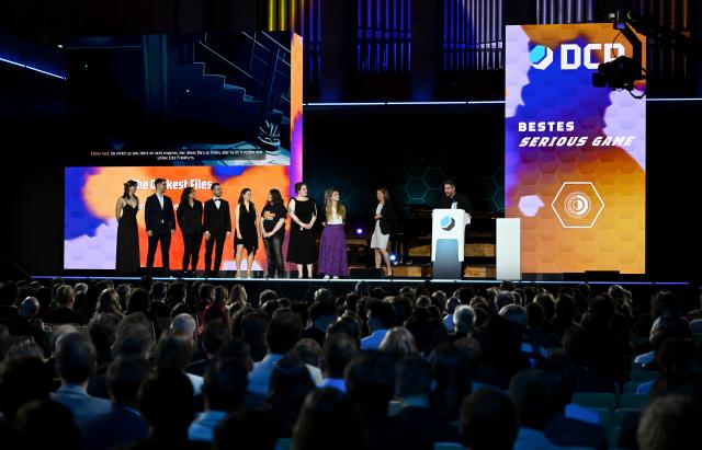 29 April 2026, Bavaria, Munich: The team behind *The Darkest Files* (Paintbucket Games) is on stage at the German Computer Game Awards (DCP). Photo: Sven Hoppe/dpa