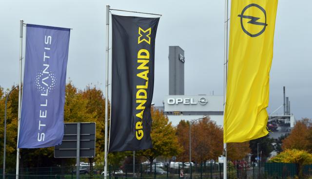 FILED - 19 October 2021, Thuringia, Eisenach: FILE PHOTO - "Stellantis", "Grandland X" and the Opel logo are seen on banners in front of the Opel Automobile GmbH Eisenach plant. Photo: Martin Schutt/dpa-Zentralbild/dpa
