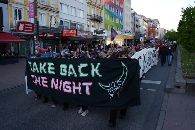30 April 2026, Hamburg: Participants hold up signs during the queer-feminist "Take Back the Night" demonstration against capitalism and patriarchy. Photo: Marcus Brandt/dpa