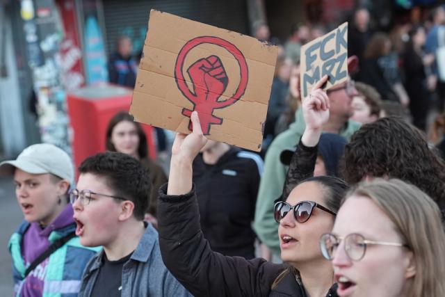 30 April 2026, Hamburg: Participants hold up signs during the queer-feminist "Take Back the Night" demonstration against capitalism and patriarchy. Photo: Marcus Brandt/dpa