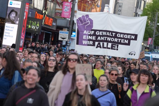30 April 2026, Hamburg: Participants hold up signs during the queer-feminist "Take Back the Night" demonstration against capitalism and patriarchy. Photo: Marcus Brandt/dpa